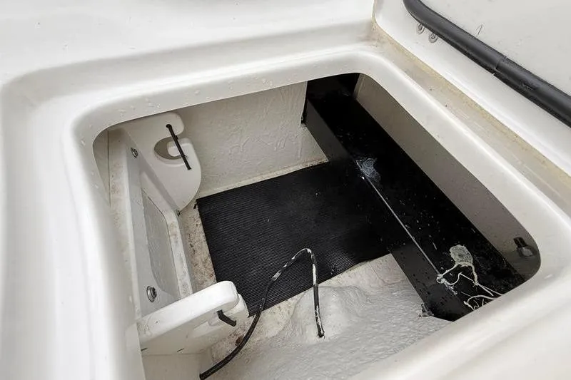 Slide: The Image of Storage compartment of 2023 Sea Hunt Ultra 255 SE boat, featuring a clean, spacious interior. - 38