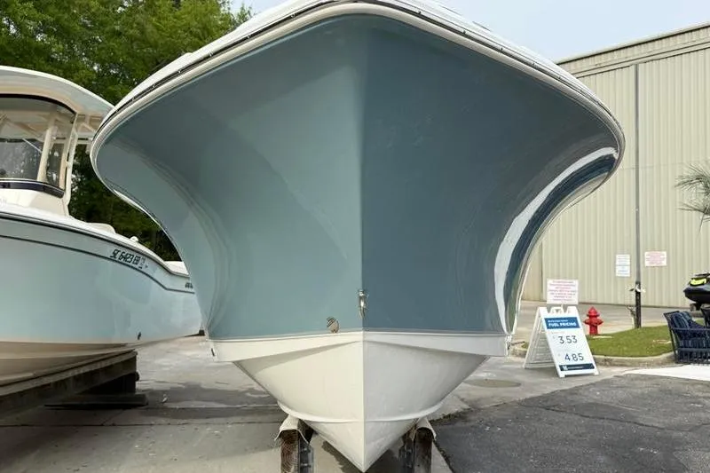 Slide: The Image of 2023 Sea Hunt Ultra 255 SE boat displayed outdoors, showcasing sleek hull design. - 5