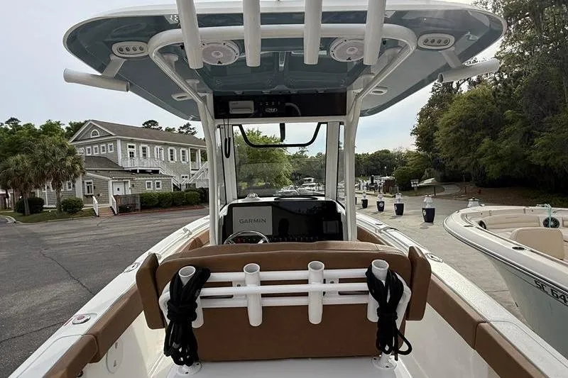 Slide: The Image of 2023 Sea Hunt Ultra 255 SE boat interior with rod holders and Garmin equipment. - 9