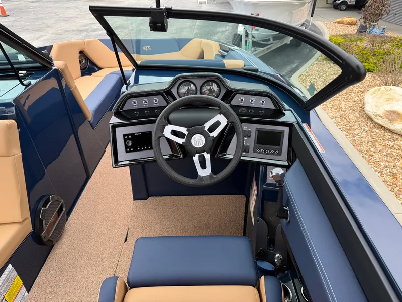 Slide: The Image of Interior of 2022 MasterCraft NXT24 with steering console and seating. - 11