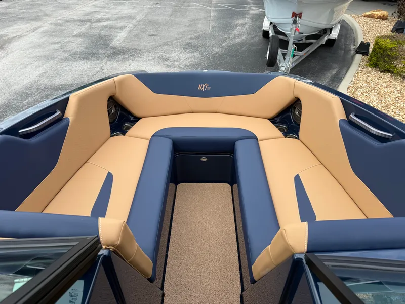 Slide: The Image of Interior of 2022 MasterCraft NXT24 with blue and beige seating. - 14