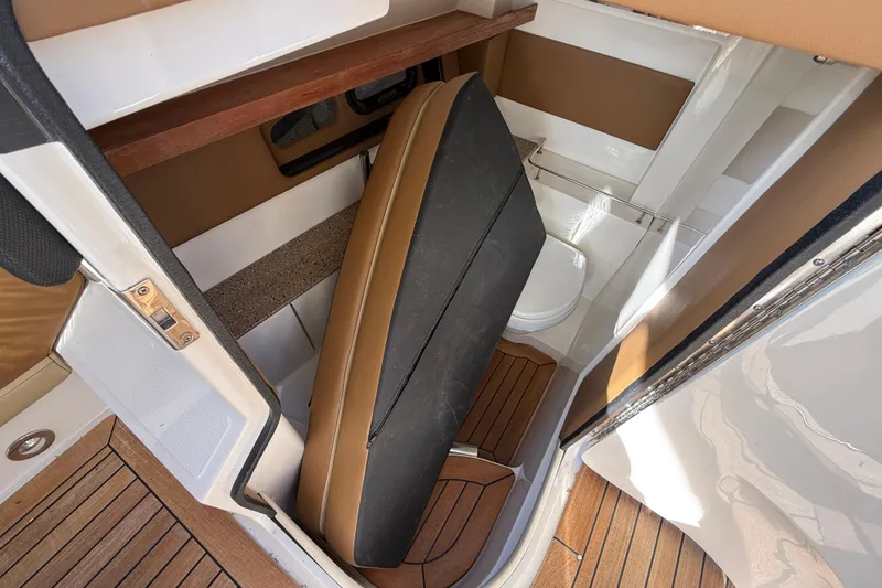 Slide: The Image of Interior of 2014 Sea Ray SLX 350 boat with compact bathroom and wooden flooring. - 20