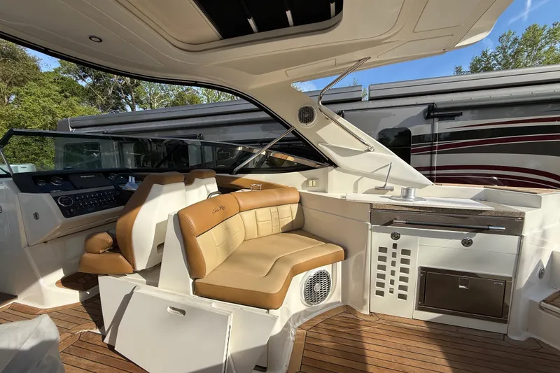 Slide: The Image of Luxurious interior of a 2014 Sea Ray SLX 350 boat with tan leather seating. - 39