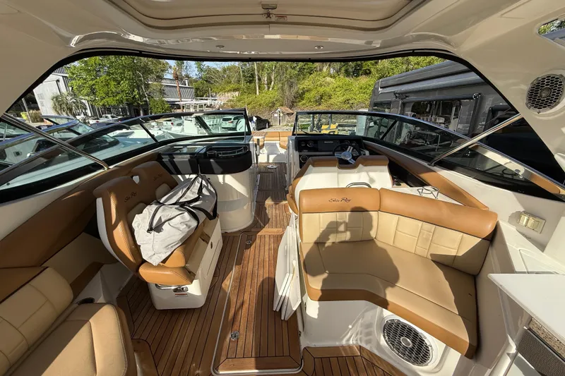 Slide: The Image of Luxurious interior of a 2014 Sea Ray SLX 350 boat with tan leather seating. - 8