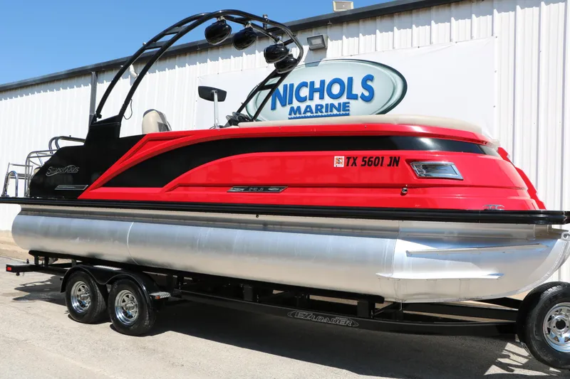 The Image of Red 2021 Silver Wave 2410 SW5 JS pontoon boat on trailer at Nichols Marine. - 1