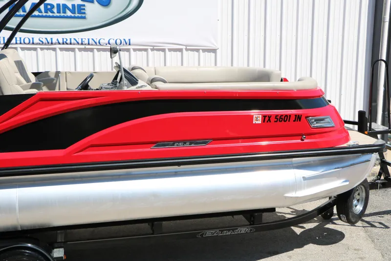 Slide: The Image of Red and black 2021 Silver Wave 2410 SW5 JS pontoon boat on trailer. - 16