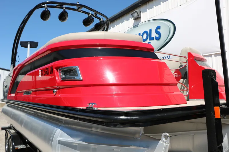 Slide: The Image of Red 2021 Silver Wave 2410 SW5 JS pontoon boat on trailer, outdoor display. - 17