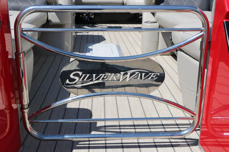 Slide: The Image of 2021 Silver Wave 2410 SW5 JS boat interior with logo on metal gate. - 19