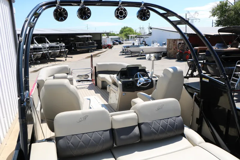Slide: The Image of Interior view of 2021 Silver Wave 2410 SW5 JS pontoon boat at a marina. - 25