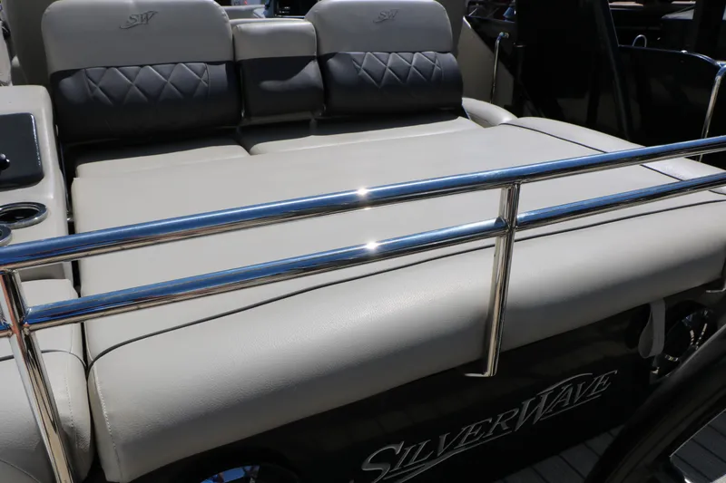 Slide: The Image of 2021 Silver Wave 2410 SW5 JS boat interior with cushioned seating and metal railing. - 27