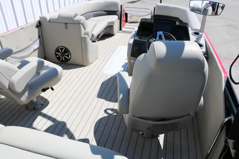 Slide: The Image of 2021 Silver Wave 2410 SW5 JS pontoon boat interior with plush seating and modern dashboard. - 29