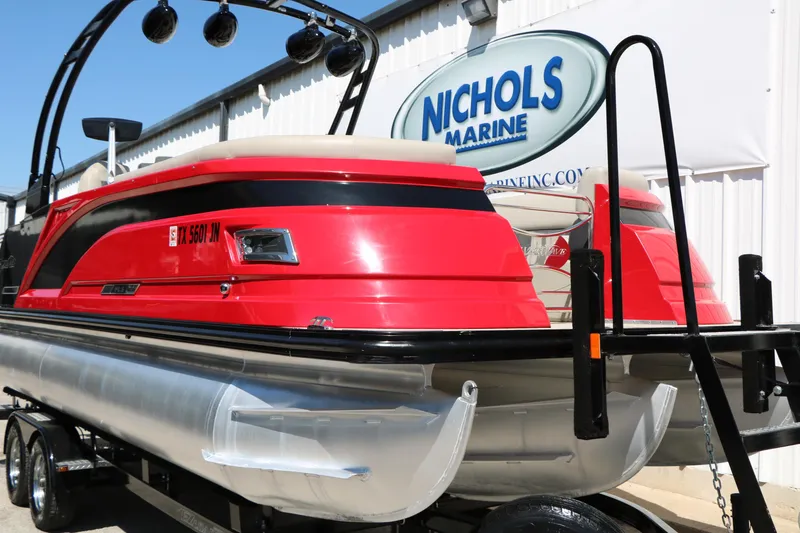 Slide: The Image of Red 2021 Silver Wave 2410 SW5 JS pontoon boat at Nichols Marine dealership. - 3
