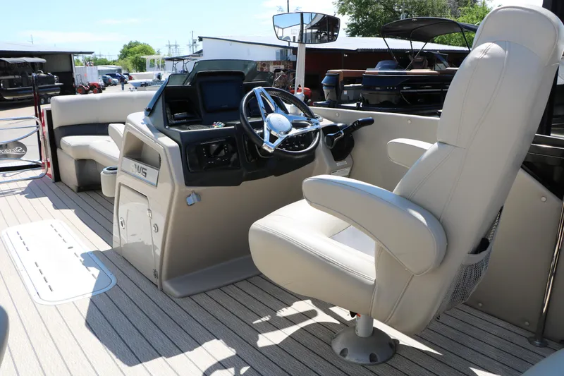 Slide: The Image of 2021 Silver Wave 2410 SW5 JS boat interior with steering console and seating. - 31