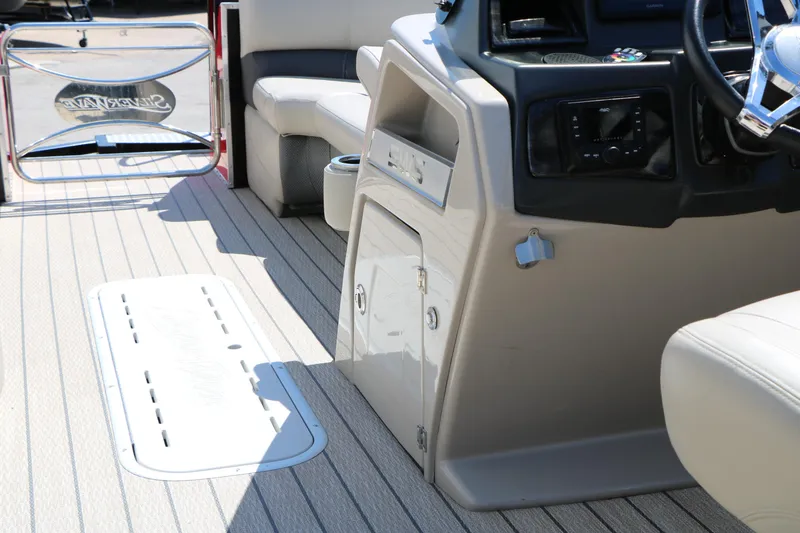 Slide: The Image of 2021 Silver Wave 2410 SW5 JS boat interior with steering console and seating. - 32