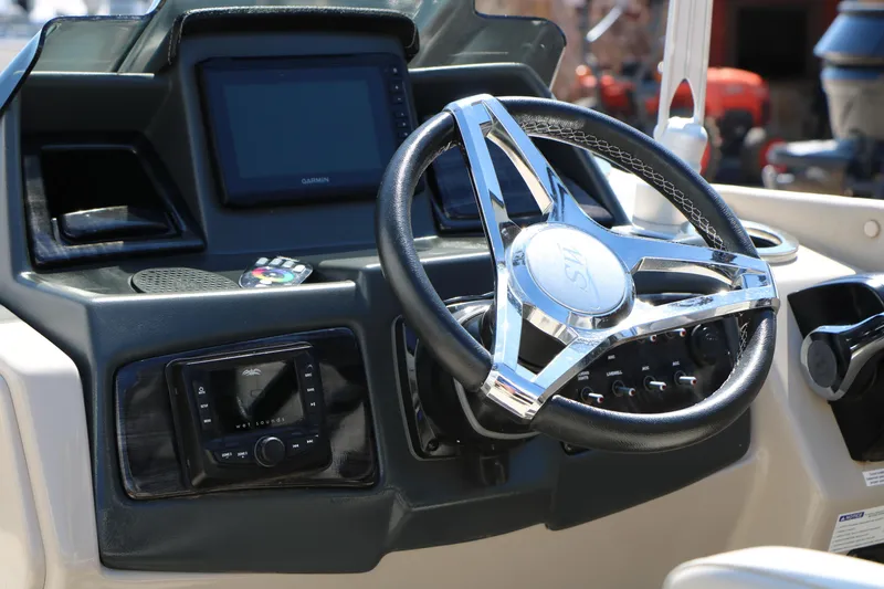 Slide: The Image of Steering console of 2021 Silver Wave 2410 SW5 JS boat with modern controls and display. - 33