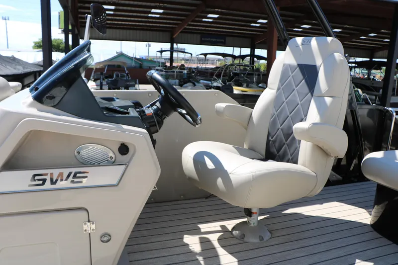 Slide: The Image of Captain's chair and helm of 2021 Silver Wave 2410 SW5 JS boat, featuring sleek design. - 36