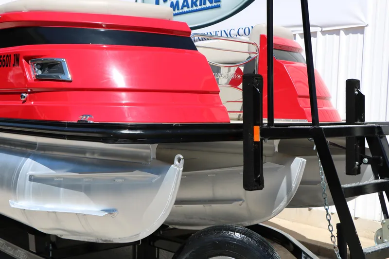 Slide: The Image of 2021 Silver Wave 2410 SW5 JS pontoon boat with red exterior on a trailer. - 4