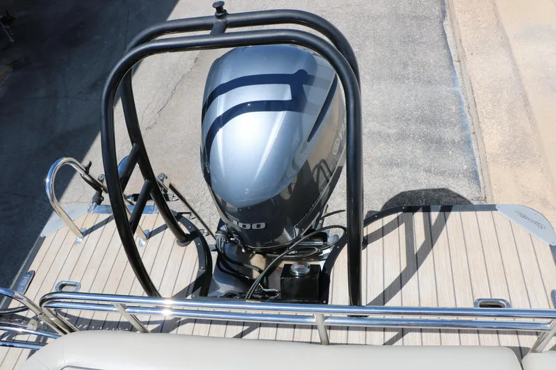 Slide: The Image of Top view of a 2021 Silver Wave 2410 SW5 JS boat engine on a wooden deck. - 42