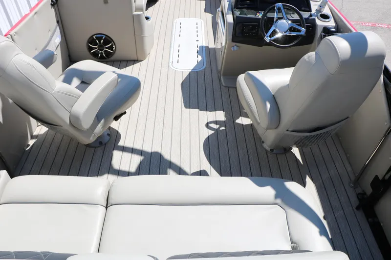 Slide: The Image of Interior of 2021 Silver Wave 2410 SW5 JS pontoon boat with plush seating and steering console. - 45