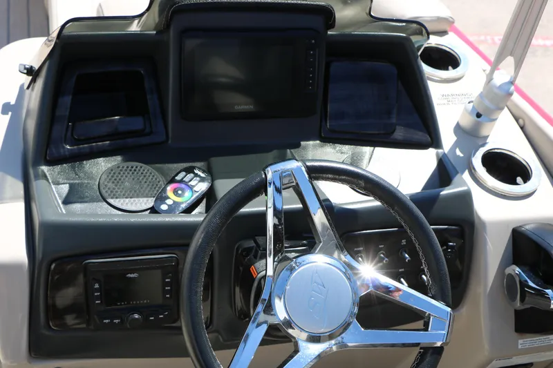 Slide: The Image of Steering console of 2021 Silver Wave 2410 SW5 JS boat with modern controls and display. - 49