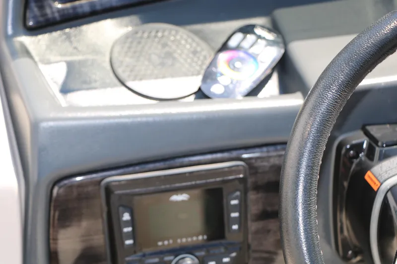 Slide: The Image of Dashboard of 2021 Silver Wave 2410 SW5 JS boat with steering wheel and control panel. - 52