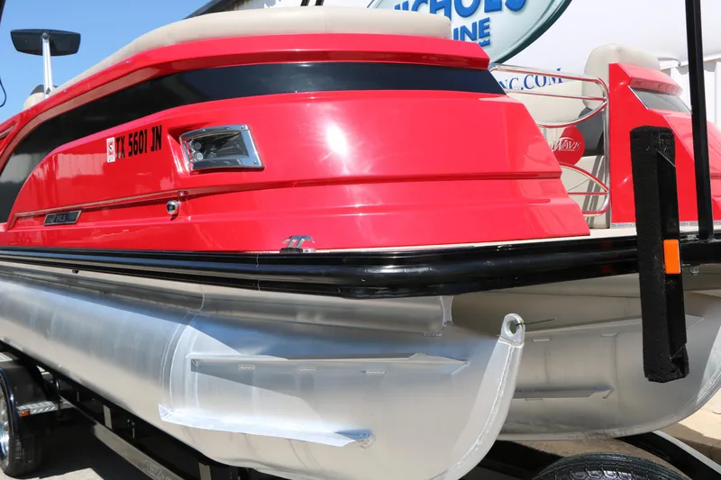Slide: The Image of Red 2021 Silver Wave 2410 SW5 JS pontoon boat on trailer, side view. - 53