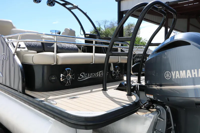Slide: The Image of 2021 Silver Wave 2410 SW5 JS pontoon boat with Yamaha engine, featuring luxurious seating. - 9