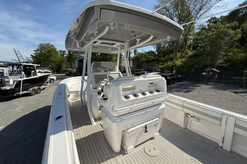 Slide: The Image of 2020 Intrepid 327 Center Console boat with spacious deck and modern controls. - 13