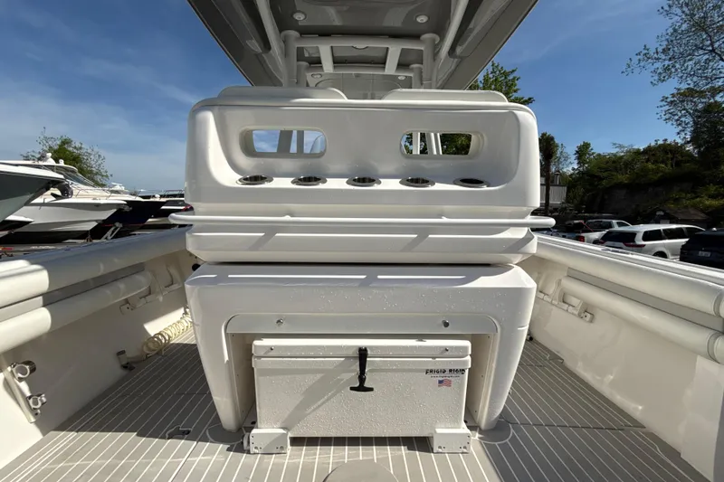 Slide: The Image of 2020 Intrepid 327 Center Console boat interior with seating and storage. - 15
