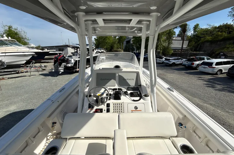 Slide: The Image of 2020 Intrepid 327 Center Console boat with Garmin navigation, docked in a marina. - 16