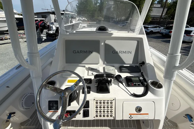 Slide: The Image of 2020 Intrepid 327 Center Console boat dashboard with Garmin navigation system. - 17