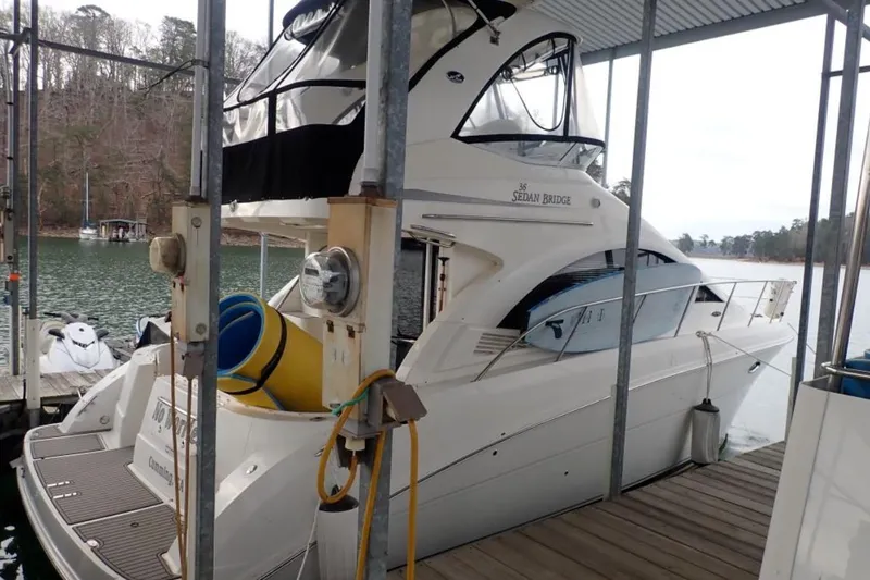 The Image of 2007 Sea Ray 36 Sedan Bridge yacht docked at a marina. - 0