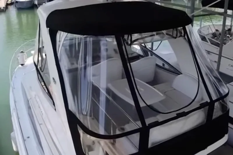 Slide: The Image of 2007 Sea Ray 36 Sedan Bridge with black canopy docked in marina. - 10