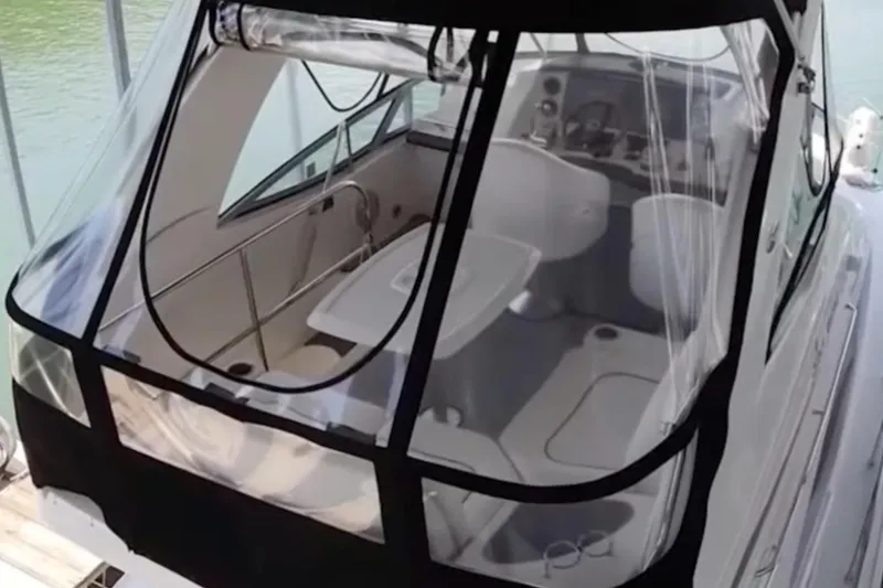 Slide: The Image of 2007 Sea Ray 36 Sedan Bridge boat with enclosed cockpit and seating area. - 11