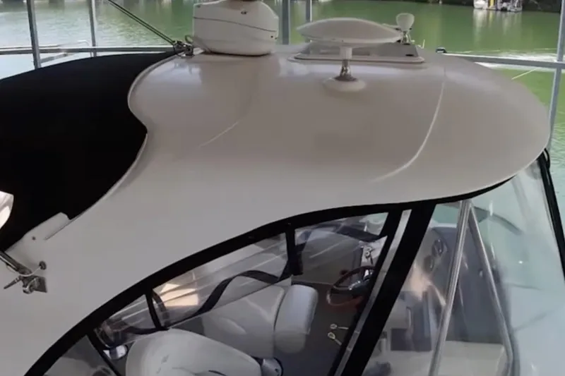 Slide: The Image of 2007 Sea Ray 36 Sedan Bridge boat with sleek white exterior and modern design. - 13