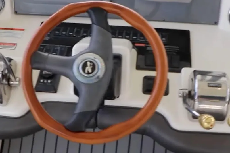 Slide: The Image of Steering wheel and controls of a 2007 Sea Ray 36 Sedan Bridge yacht. - 15