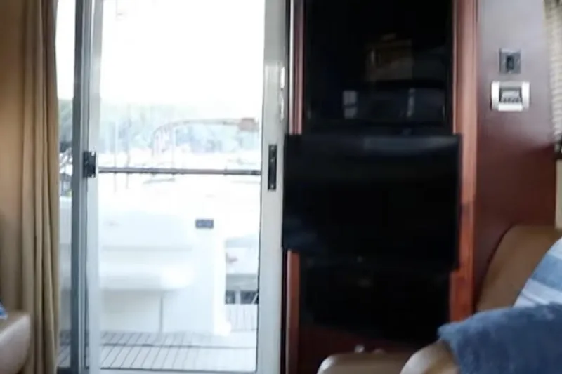 Slide: The Image of Interior view of 2007 Sea Ray 36 Sedan Bridge yacht with sliding glass door. - 18