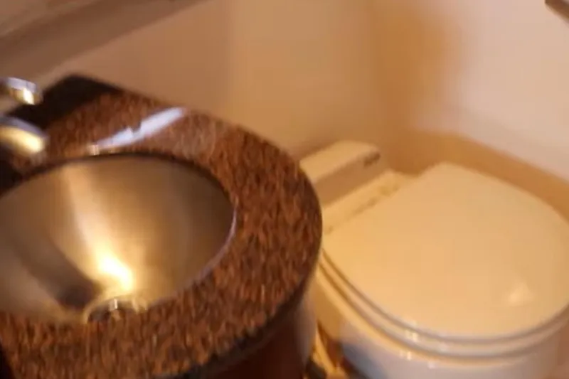 Slide: The Image of Bathroom interior of 2007 Sea Ray 36 Sedan Bridge with sink and toilet. - 21