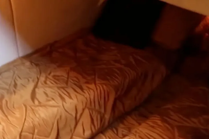 Slide: The Image of Interior cabin of 2007 Sea Ray 36 Sedan Bridge with cozy bedding. - 22