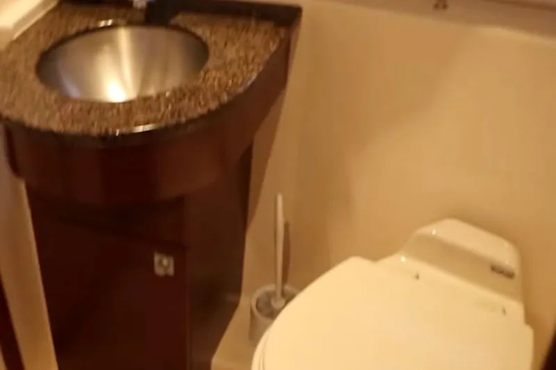 Slide: The Image of Luxurious bathroom in 2007 Sea Ray 36 Sedan Bridge yacht with modern sink and toilet. - 24