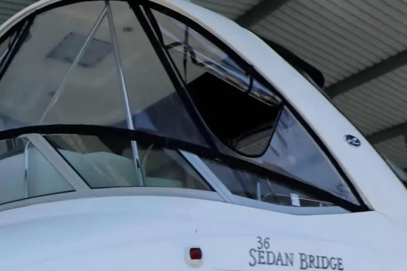 Slide: The Image of 2007 Sea Ray 36 Sedan Bridge yacht under a covered dock. - 5