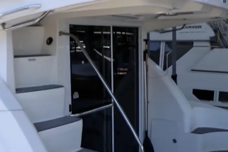 Slide: The Image of 2007 Sea Ray 36 Sedan Bridge yacht entrance with steps and sliding door. - 7
