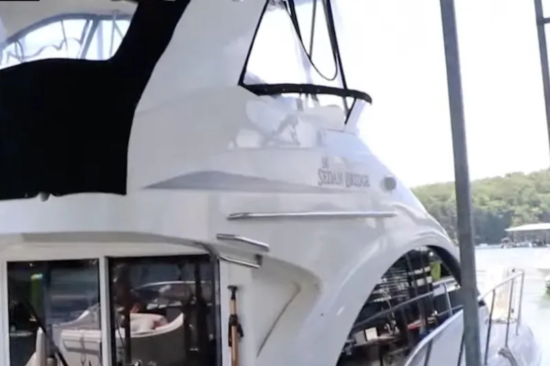 Slide: The Image of 2007 Sea Ray 36 Sedan Bridge yacht docked at a marina. - 9