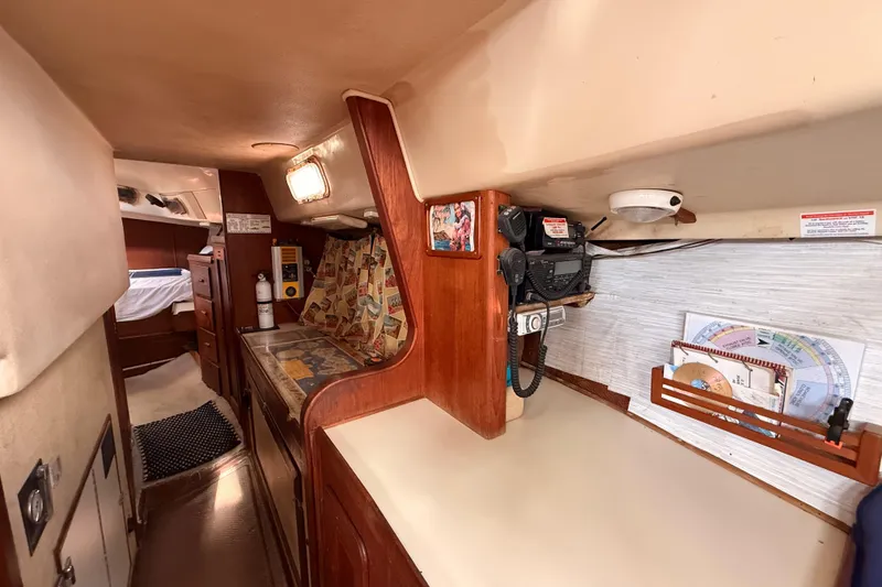 Slide: The Image of 1978 Morgan 452 yacht interior with wood accents and navigation equipment. - 24