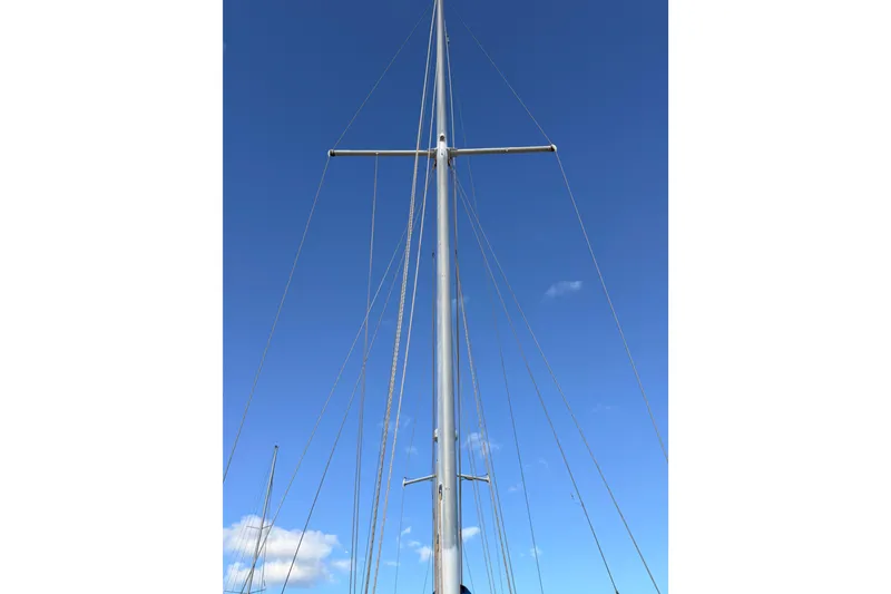Slide: The Image of Tall sailboat mast against clear blue sky, Morgan 452, 1978 model. - 39