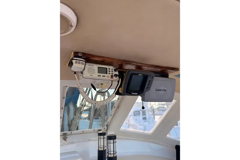 Slide: The Image of 1978 Morgan 452 yacht cockpit with Garmin navigation equipment and radio system. - 46