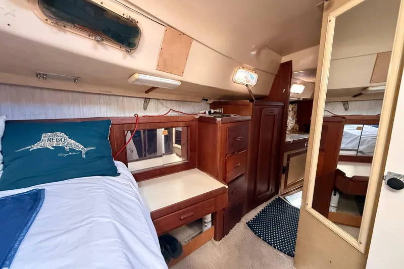 Slide: The Image of Cozy 1978 Morgan 452 yacht cabin with wooden furnishings and nautical decor. - 6
