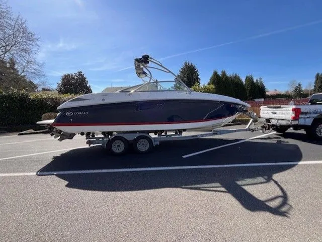 The Image of 2007 Cobalt 252 boat on trailer parked outdoors. - 1