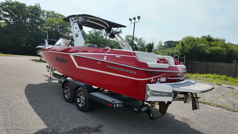 Slide: The Image of Red 2017 Malibu Wakesetter 24 MXZ boat on trailer. - 3