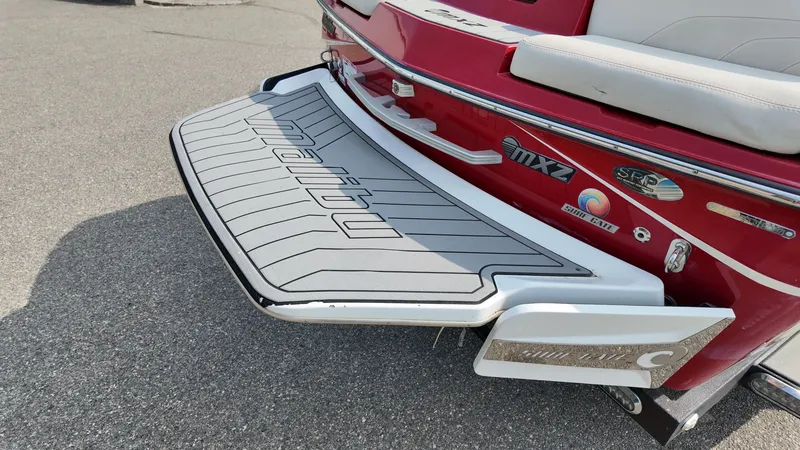 Slide: The Image of Red 2017 Malibu Wakesetter 24 MXZ boat with gray rear deck. - 5